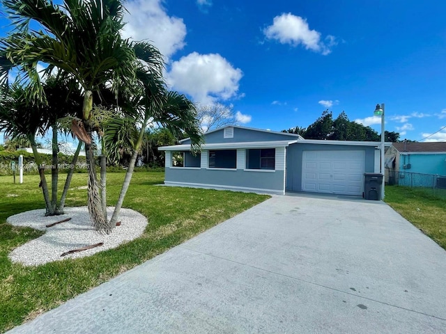 4562 Old Military Trl, West Palm Beach, FL 33417 - ranch-style home featuring a garage, driveway, and stucco siding