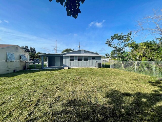 4562 Old Military Trl, West Palm Beach, FL 33417 - rear view of house featuring central air condition unit