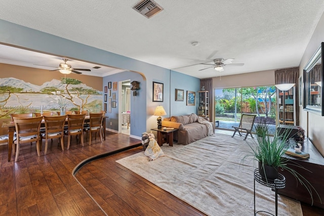 1305 N 47th Ave, Hollywood, FL 33021 - living room with a ceiling fan, wood-type flooring, a textured ceiling, and arched walkways