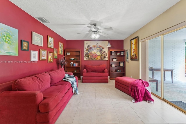 1305 N 47th Ave, Hollywood, FL 33021 - living area with a ceiling fan, plenty of natural light, a textured ceiling, and tile patterned floors