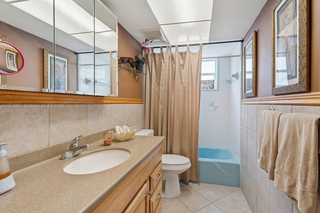1305 N 47th Ave, Hollywood, FL 33021 - bathroom featuring vanity, tile patterned flooring, tile walls, and shower / tub combo