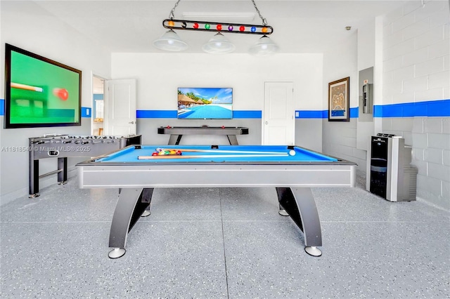2496 Rama Dr, Kissimmee, FL 34746 - recreation room with pool table, concrete block wall, and speckled floor