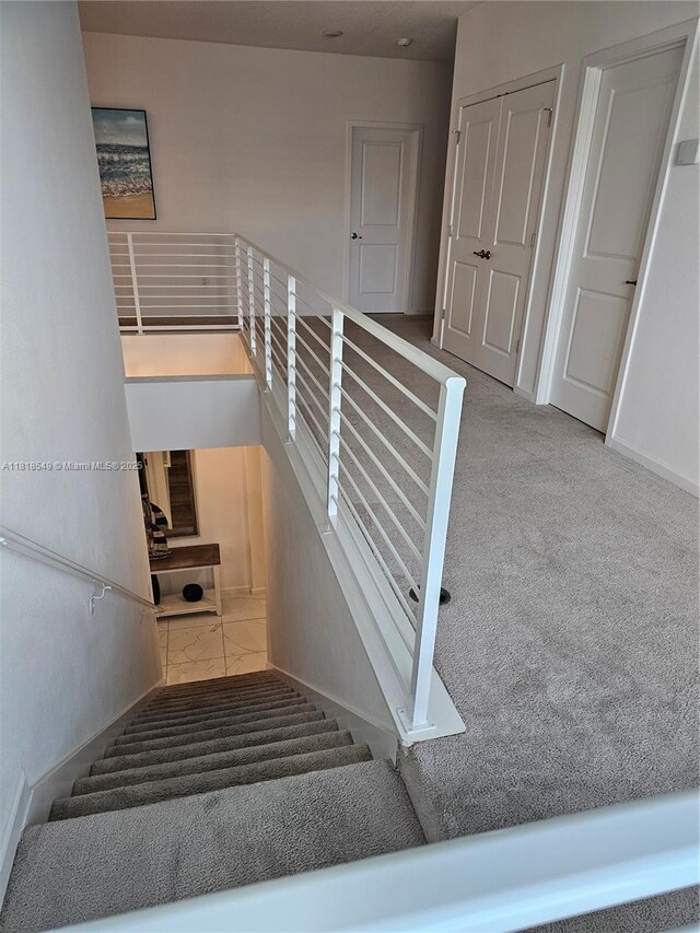 2496 Rama Dr, Kissimmee, FL 34746 - staircase featuring baseboards