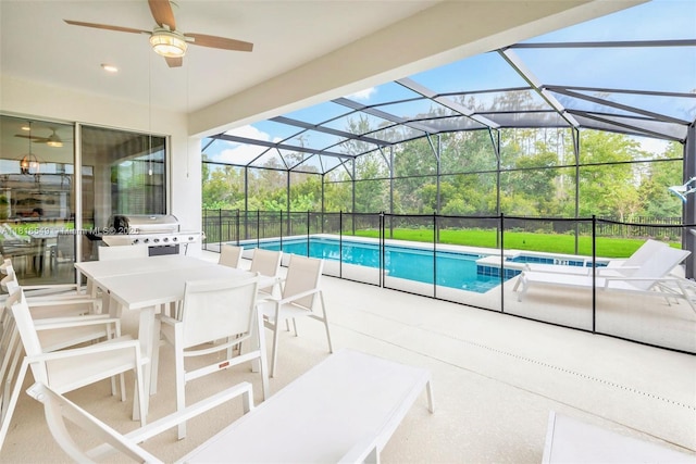 2496 Rama Dr, Kissimmee, FL 34746 - view of pool with outdoor dining space, a patio, ceiling fan, a pool with connected hot tub, and a lanai