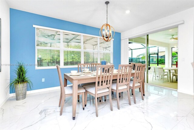 2496 Rama Dr, Kissimmee, FL 34746 - dining room featuring marble tiled flooring, a chandelier, recessed lighting, and a ceiling fan