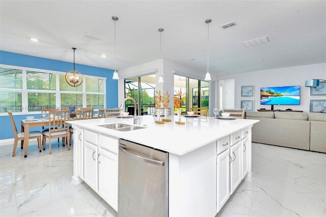2496 Rama Dr, Kissimmee, FL 34746 - kitchen featuring dishwasher, light marble finish flooring, a center island with sink, plenty of natural light, and recessed lighting