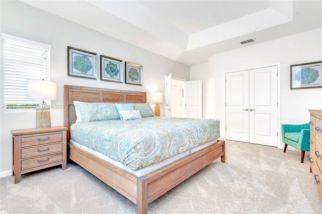 2496 Rama Dr, Kissimmee, FL 34746 - bedroom featuring carpet flooring, a closet, and a raised ceiling