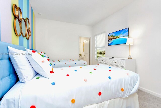 2496 Rama Dr, Kissimmee, FL 34746 - carpeted bedroom with baseboards