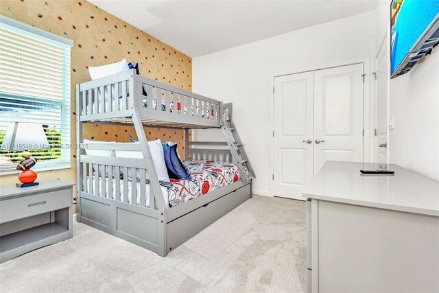 2496 Rama Dr, Kissimmee, FL 34746 - carpeted bedroom featuring wallpapered walls and a closet
