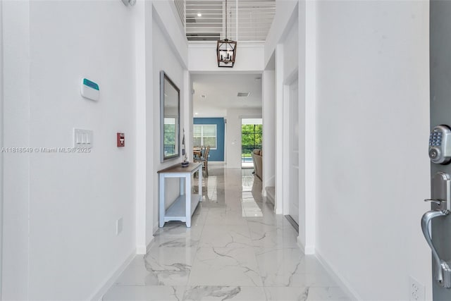 2496 Rama Dr, Kissimmee, FL 34746 - hall with baseboards and light marble finish flooring