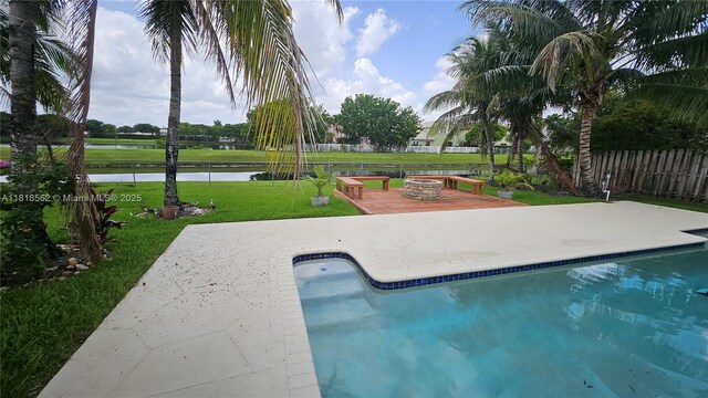 9480 NW 10th St, Plantation, FL 33322 - view of pool with a patio, a fire pit, and a water view