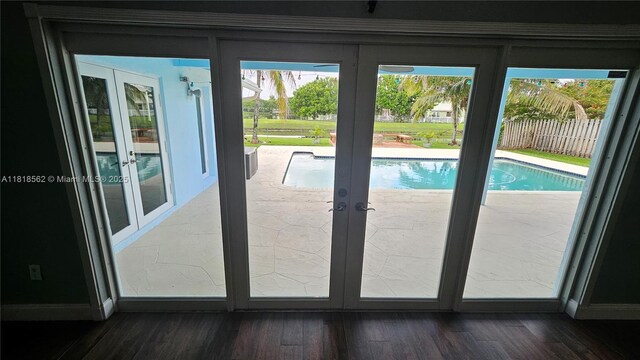 9480 NW 10th St, Plantation, FL 33322 - doorway to outside featuring french doors, plenty of natural light, and wood finished floors