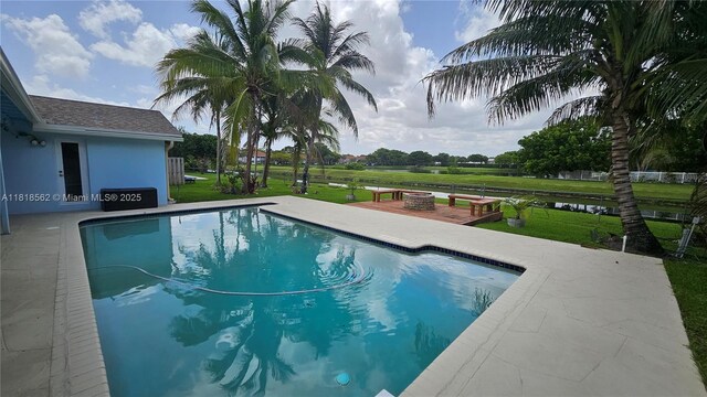 9480 NW 10th St, Plantation, FL 33322 - outdoor pool featuring a fire pit, a yard, and a patio