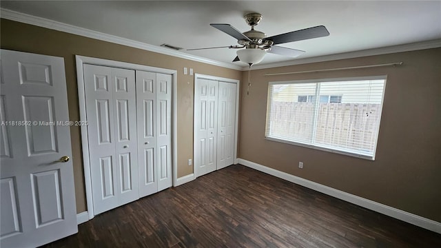 9480 NW 10th St, Plantation, FL 33322 - unfurnished bedroom featuring baseboards, dark wood-type flooring, multiple closets, ornamental molding, and ceiling fan