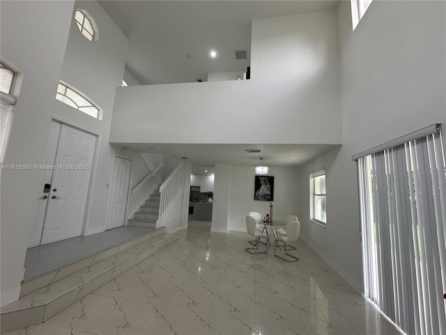 16650 SW 61st Ln, Miami, FL 33193 - entryway with light marble finish flooring, a towering ceiling, and stairs