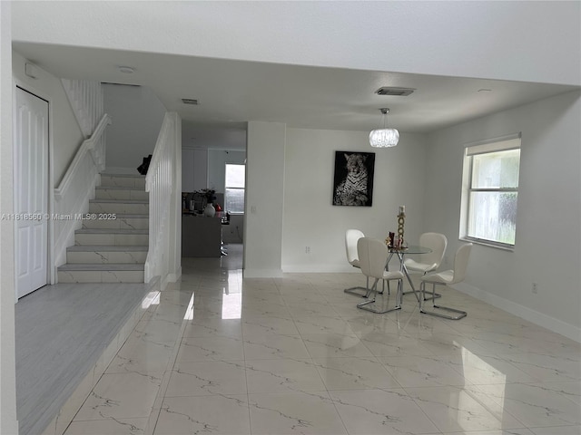16650 SW 61st Ln, Miami, FL 33193 - dining area featuring stairway, healthy amount of natural light, and marble finish flooring
