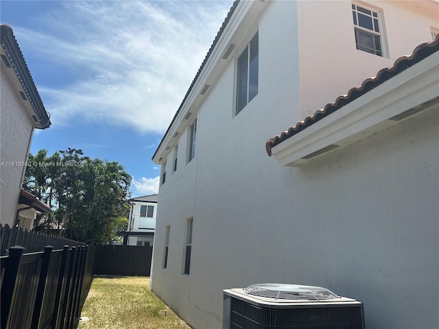 16650 SW 61st Ln, Miami, FL 33193 - view of side of property with stucco siding and a tile roof