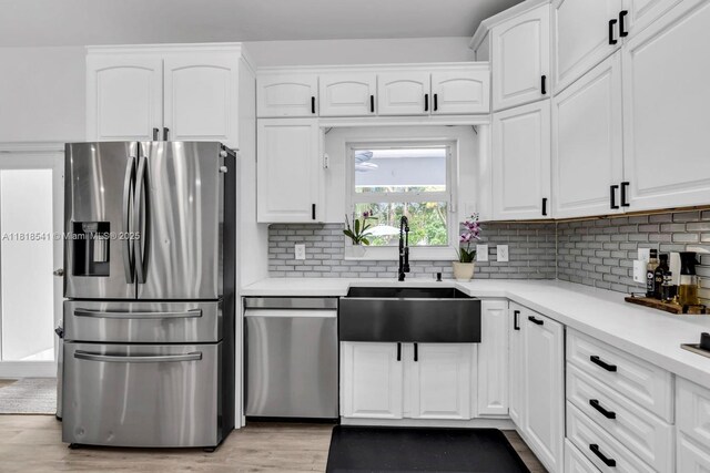 11400 NW 27th St, Plantation, FL 33323 - kitchen featuring stainless steel appliances, a sink, and white cabinetry