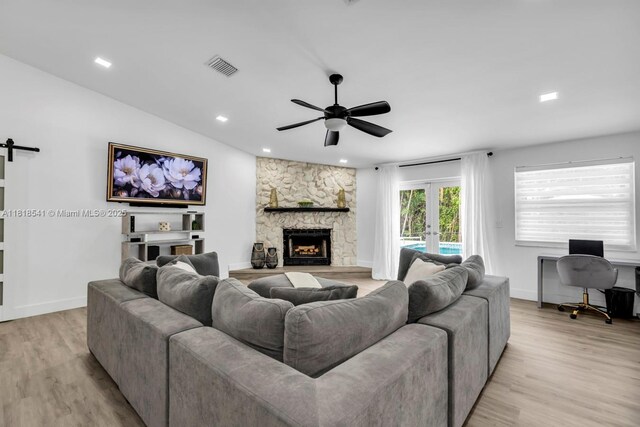 11400 NW 27th St, Plantation, FL 33323 - living room featuring ceiling fan, light wood-style floors, a stone fireplace, a desk, and recessed lighting