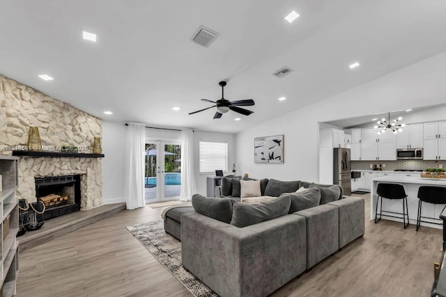 11400 NW 27th St, Plantation, FL 33323 - living room featuring ceiling fan, light wood-style floors, a stone fireplace, a desk, and recessed lighting