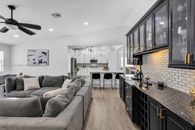11400 NW 27th St, Plantation, FL 33323 - living room featuring a chandelier, light wood finished floors, ceiling fan, and recessed lighting