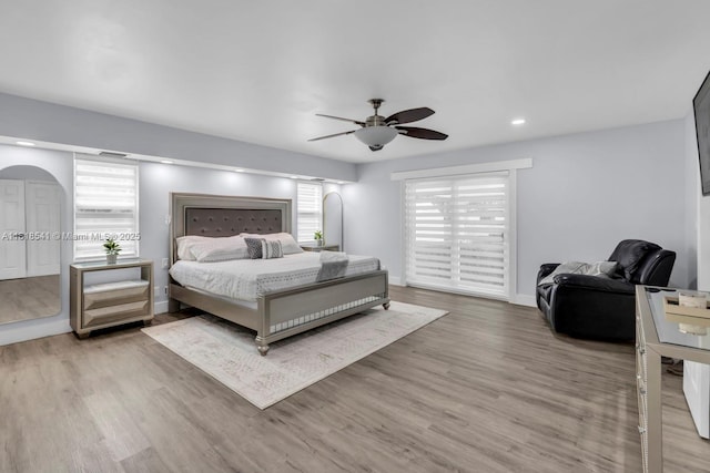 11400 NW 27th St, Plantation, FL 33323 - bedroom with wood finished floors, arched walkways, recessed lighting, a ceiling fan, and baseboards