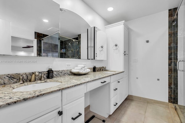 11400 NW 27th St, Plantation, FL 33323 - full bathroom with a shower stall, double vanity, tile patterned floors, and baseboards