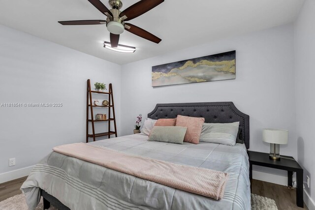 11400 NW 27th St, Plantation, FL 33323 - bedroom with wood finished floors, baseboards, and ceiling fan