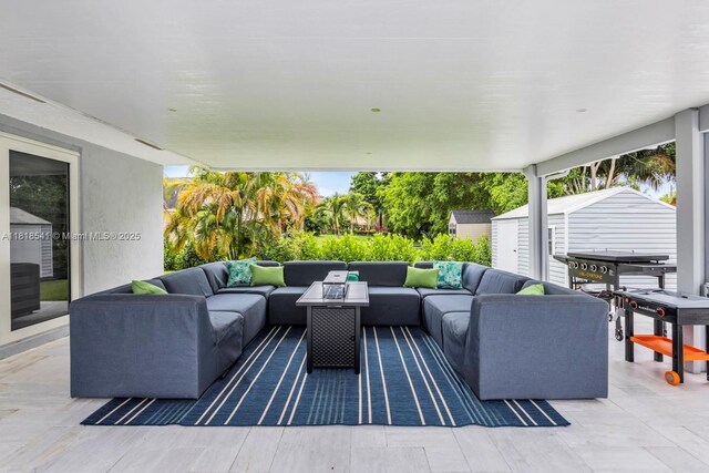 11400 NW 27th St, Plantation, FL 33323 - view of patio featuring an outdoor living space and a storage shed