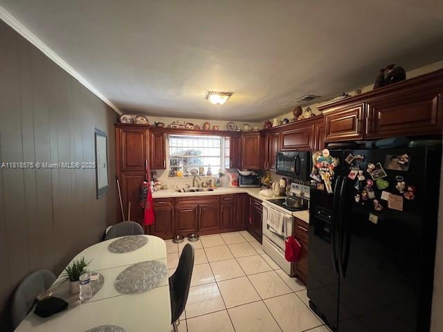 77 NW Blvd, Miami, FL 33126 - kitchen with black appliances, light countertops, light tile patterned floors, crown molding, and a sink