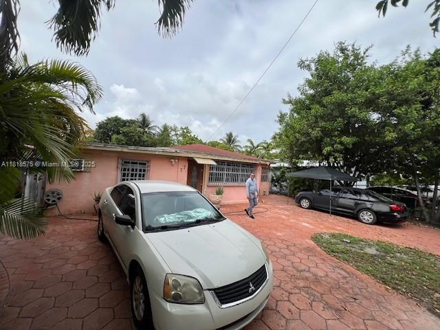 77 NW Blvd, Miami, FL 33126 - view of front of house featuring stucco siding