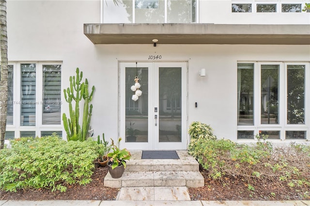 10540 NW 63rd Ter, Doral, FL 33178 - view of exterior entry featuring french doors and stucco siding