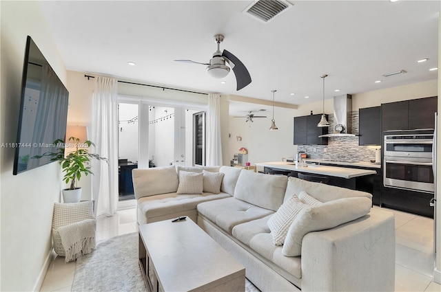 10540 NW 63rd Ter, Doral, FL 33178 - living area with a ceiling fan, light tile patterned flooring, and recessed lighting