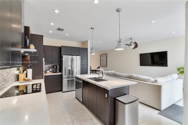 10540 NW 63rd Ter, Doral, FL 33178 - kitchen featuring a sink, stainless steel appliances, light tile patterned floors, tasteful backsplash, and recessed lighting