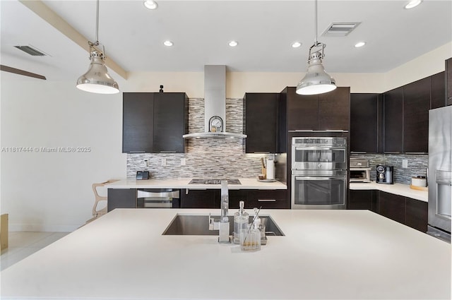 10540 NW 63rd Ter, Doral, FL 33178 - kitchen with a sink, stainless steel appliances, wall chimney exhaust hood, light countertops, and tasteful backsplash