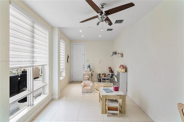 10540 NW 63rd Ter, Doral, FL 33178 - tiled living area with ceiling fan and baseboards