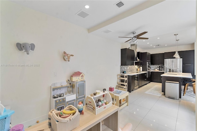 10540 NW 63rd Ter, Doral, FL 33178 - kitchen with stainless steel fridge with ice dispenser, dark cabinets, light countertops, a sink, and tasteful backsplash