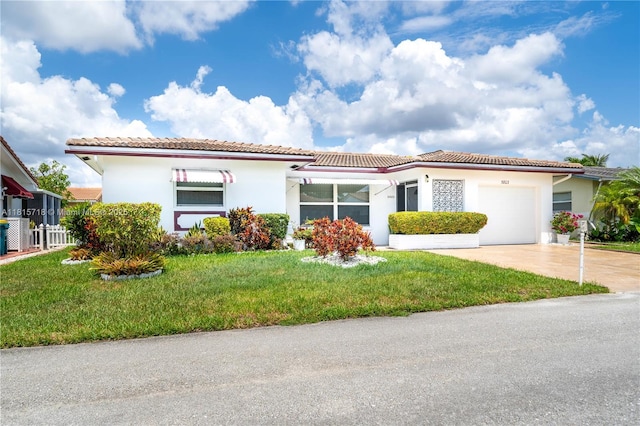 5803 NW 85th Ter, Tamarac, FL 33321 - mediterranean / spanish-style house with a garage, stucco siding, driveway, a tiled roof, and a front lawn
