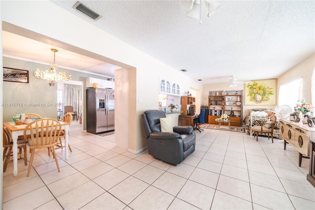 5803 NW 85th Ter, Tamarac, FL 33321 - living room with a chandelier, healthy amount of natural light, light tile patterned floors, and a textured ceiling