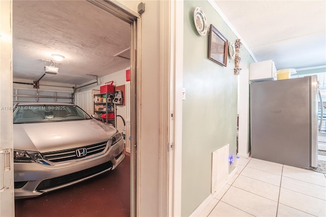 5803 NW 85th Ter, Tamarac, FL 33321 - garage with freestanding refrigerator and a garage door opener