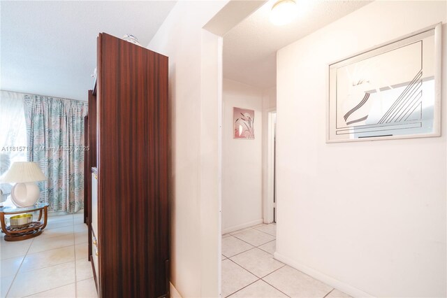 5803 NW 85th Ter, Tamarac, FL 33321 - hall with light tile patterned floors and baseboards