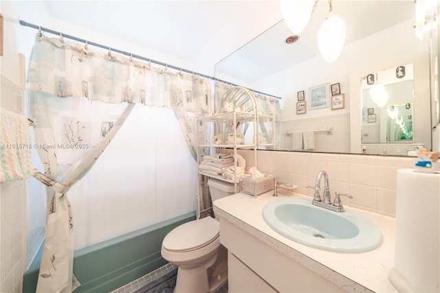 5803 NW 85th Ter, Tamarac, FL 33321 - full bath featuring tasteful backsplash, vanity, toilet, shower / tub combo with curtain, and tile walls