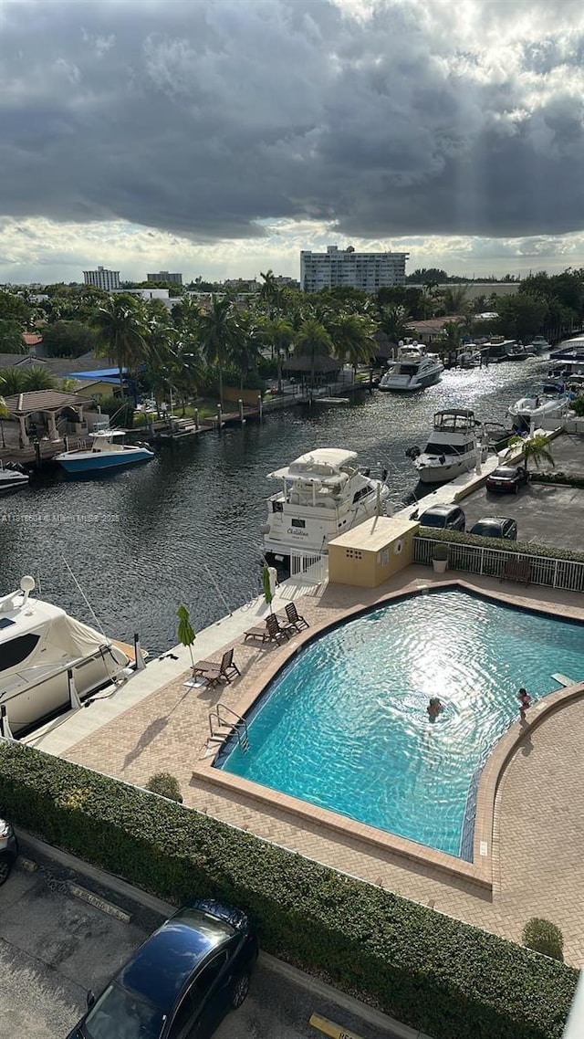 2000 NE 135th St Unit 509, North Miami, FL 33181 - view of swimming pool featuring a water view