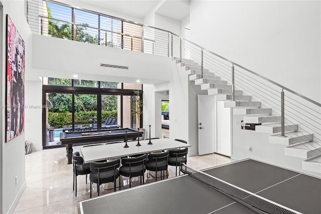 3660 SW 12th St, Miami, FL 33135 - playroom featuring billiards table, a towering ceiling, and baseboards