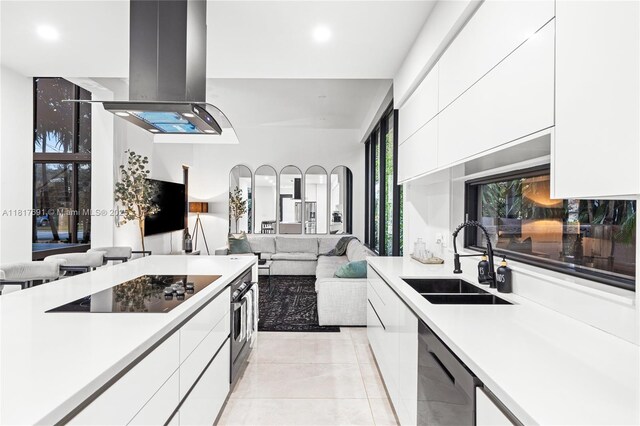 3660 SW 12th St, Miami, FL 33135 - kitchen featuring a sink, modern cabinets, island range hood, stainless steel dishwasher, and recessed lighting