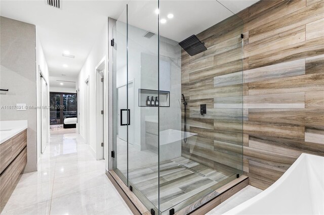 3660 SW 12th St, Miami, FL 33135 - full bathroom featuring a stall shower, a freestanding tub, vanity, ensuite bath, and recessed lighting