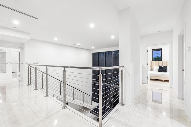 3660 SW 12th St, Miami, FL 33135 - hallway with an upstairs landing, recessed lighting, and baseboards