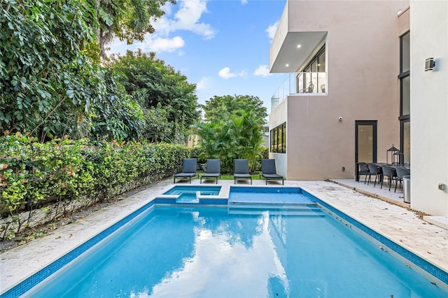 3660 SW 12th St, Miami, FL 33135 - view of pool with a pool with connected hot tub and a patio area