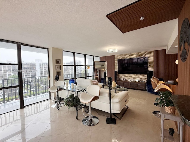 800 Parkview Dr Unit 820, Hallandale Beach, FL 33009 - living area featuring floor to ceiling windows, light tile patterned flooring, and a textured ceiling