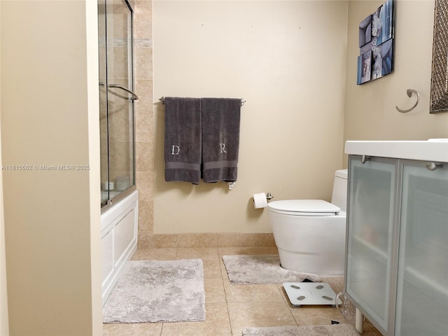 800 Parkview Dr Unit 820, Hallandale Beach, FL 33009 - bathroom with toilet, tile patterned flooring, and bath / shower combo with glass door
